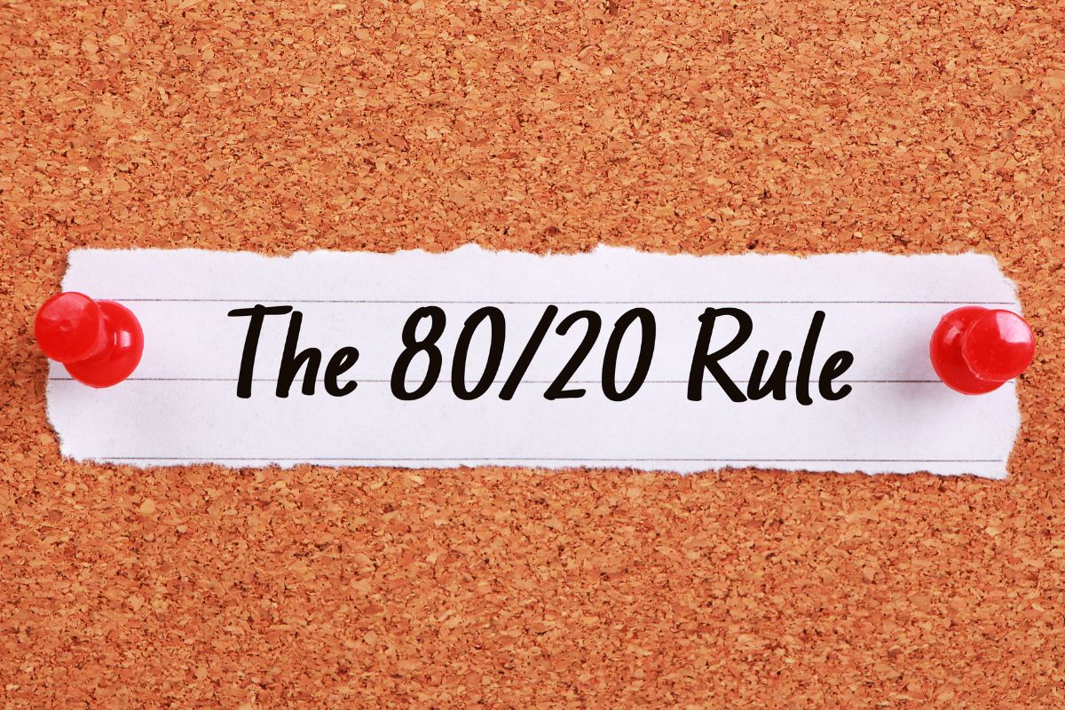 The photo shows a paper with the 80/20 budgeting rule wording.