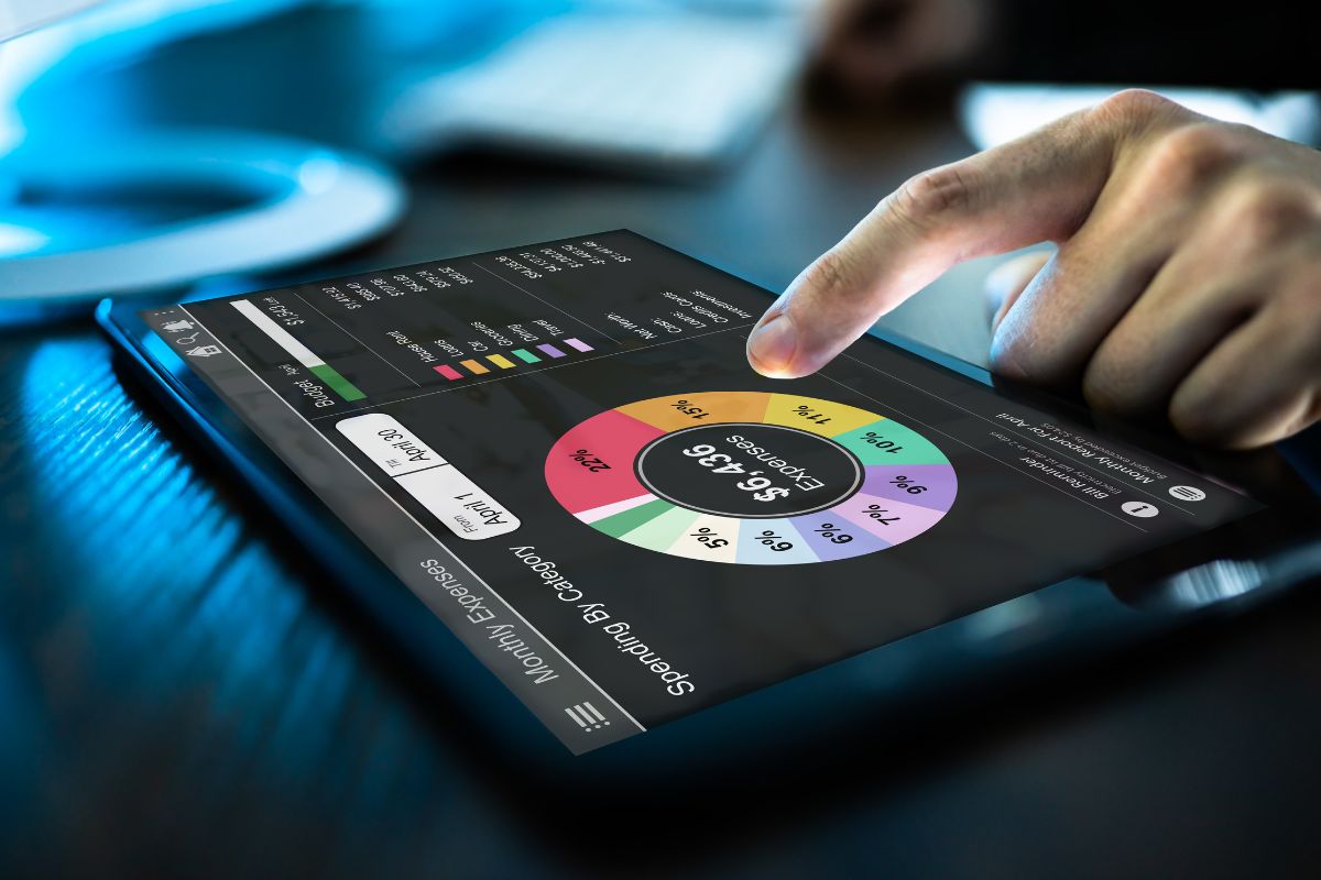 The image is about a man's hand tracking expenses.