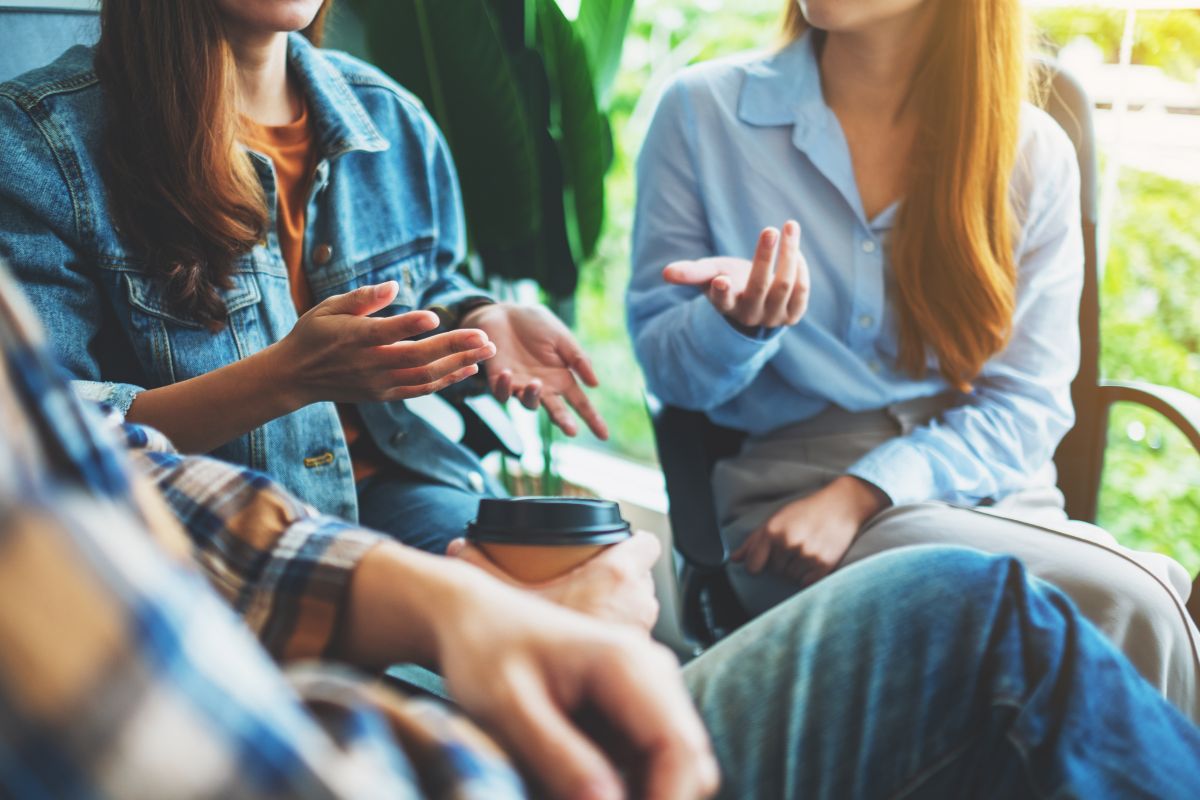 The image of young people talking together which refers to networking and relationship-building can provide mentorship, career advice, and new business ideas. 