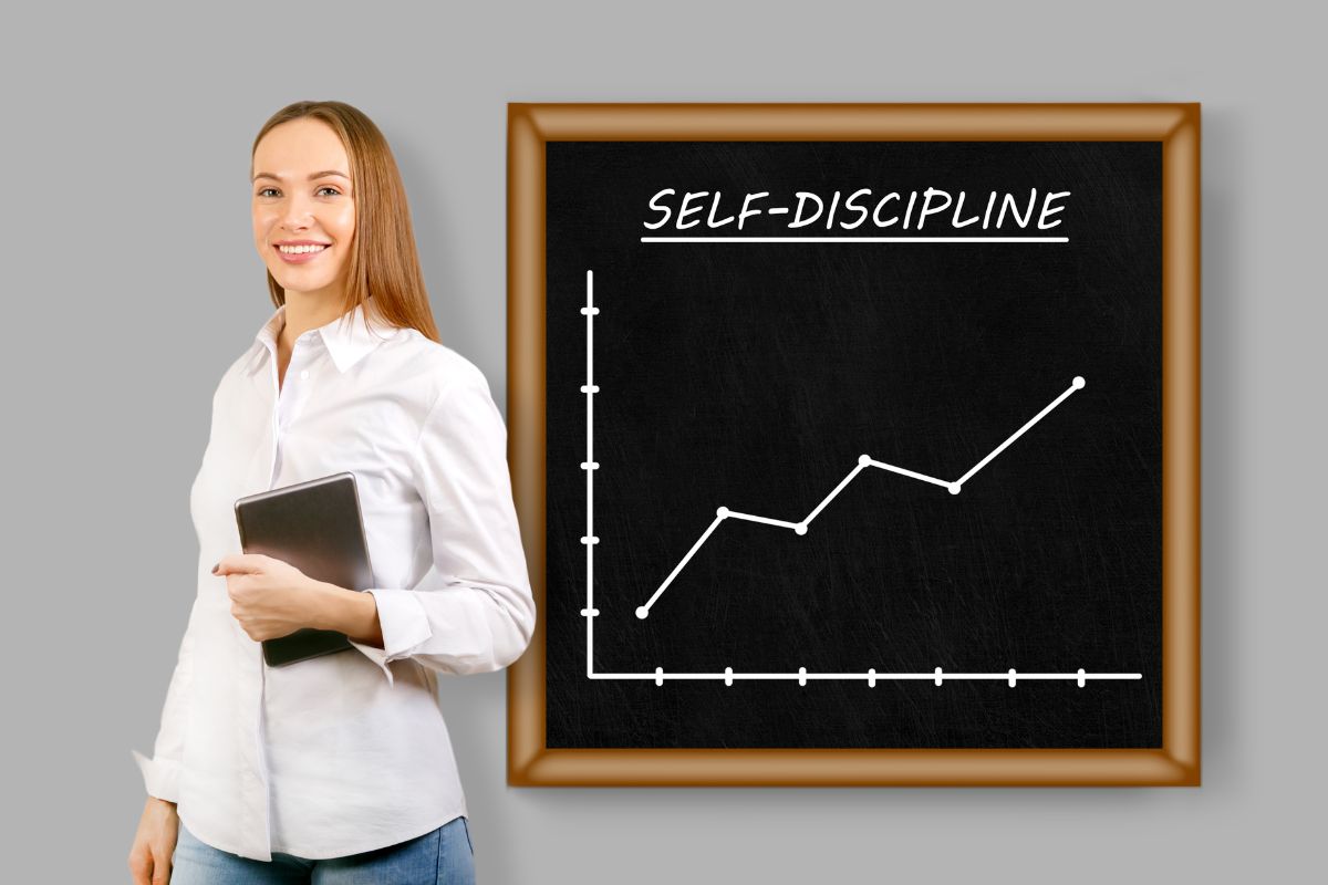 The photo shows a woman and a board with self-discipline wording.