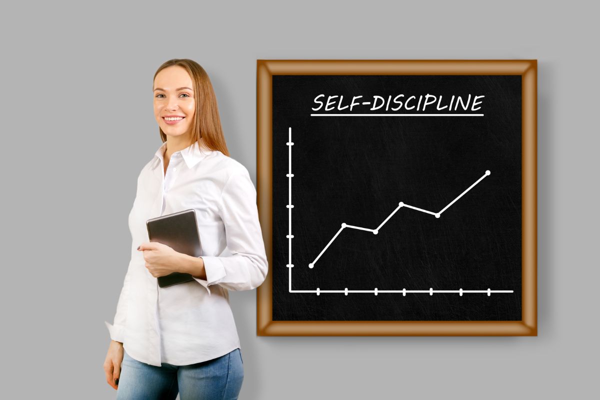 The picture shows a board with notes and graphs and a girl standing while holding a tablet device indicating that self-discipline prevents regret later in life.