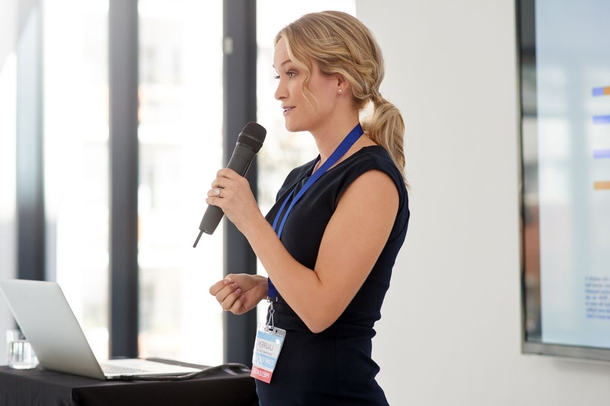 The image is about a woman with public speaking skills.