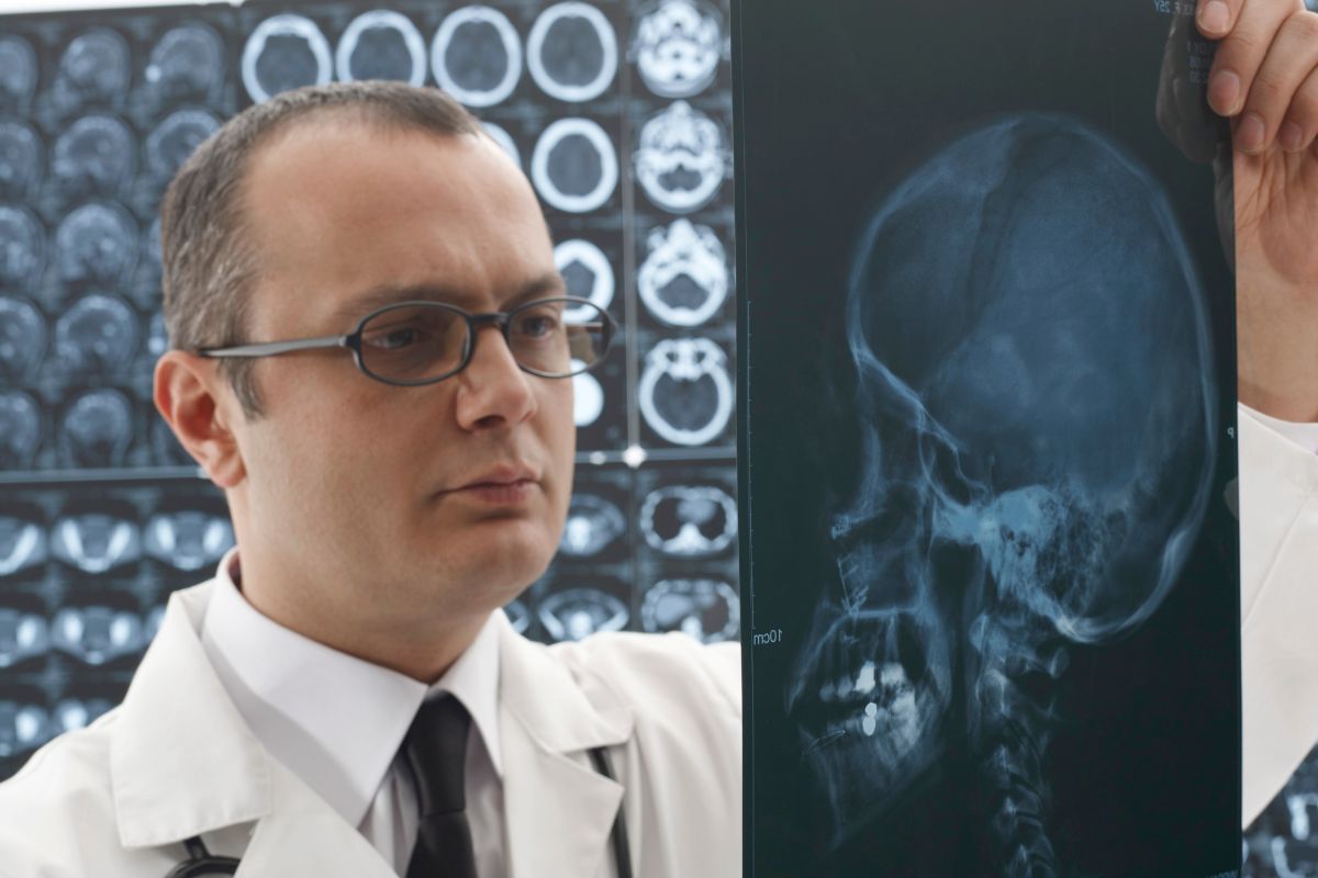 The photo shows a man working as a neurosurgeon.