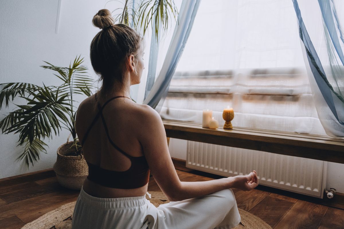 The picture shows a plant and a girl relaxing in the ambiance which refers to health and fitness management helps with handling stress and long work hours.