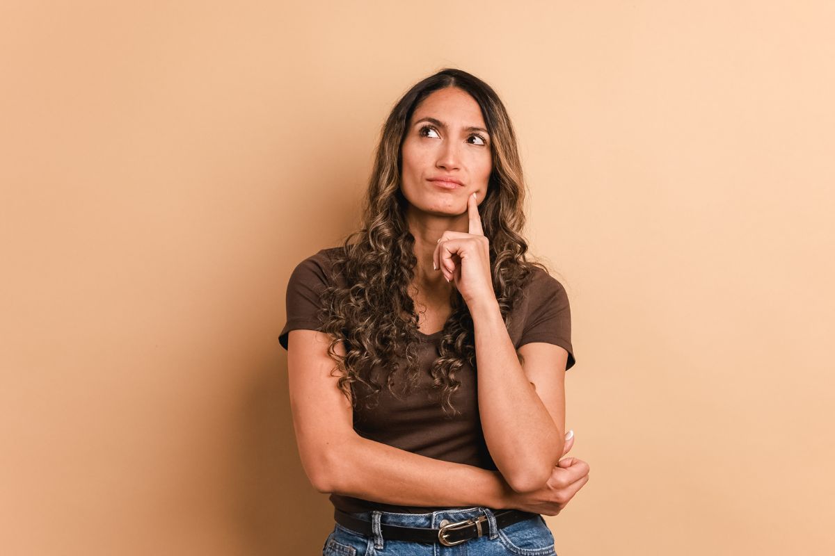 The photo tells about a girl thinking referring to decision-making under uncertainty knows how to act even when outcomes aren't clear.