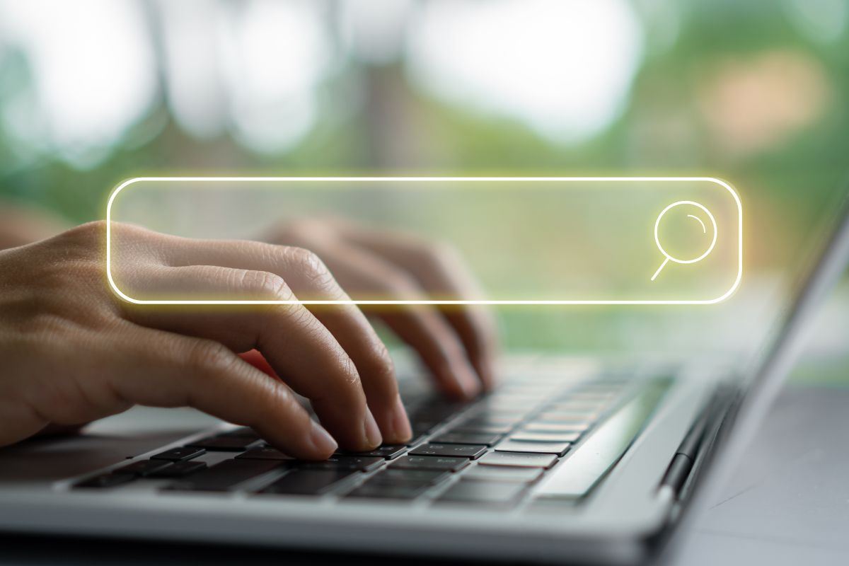 The image is about a lady's hand searching online.