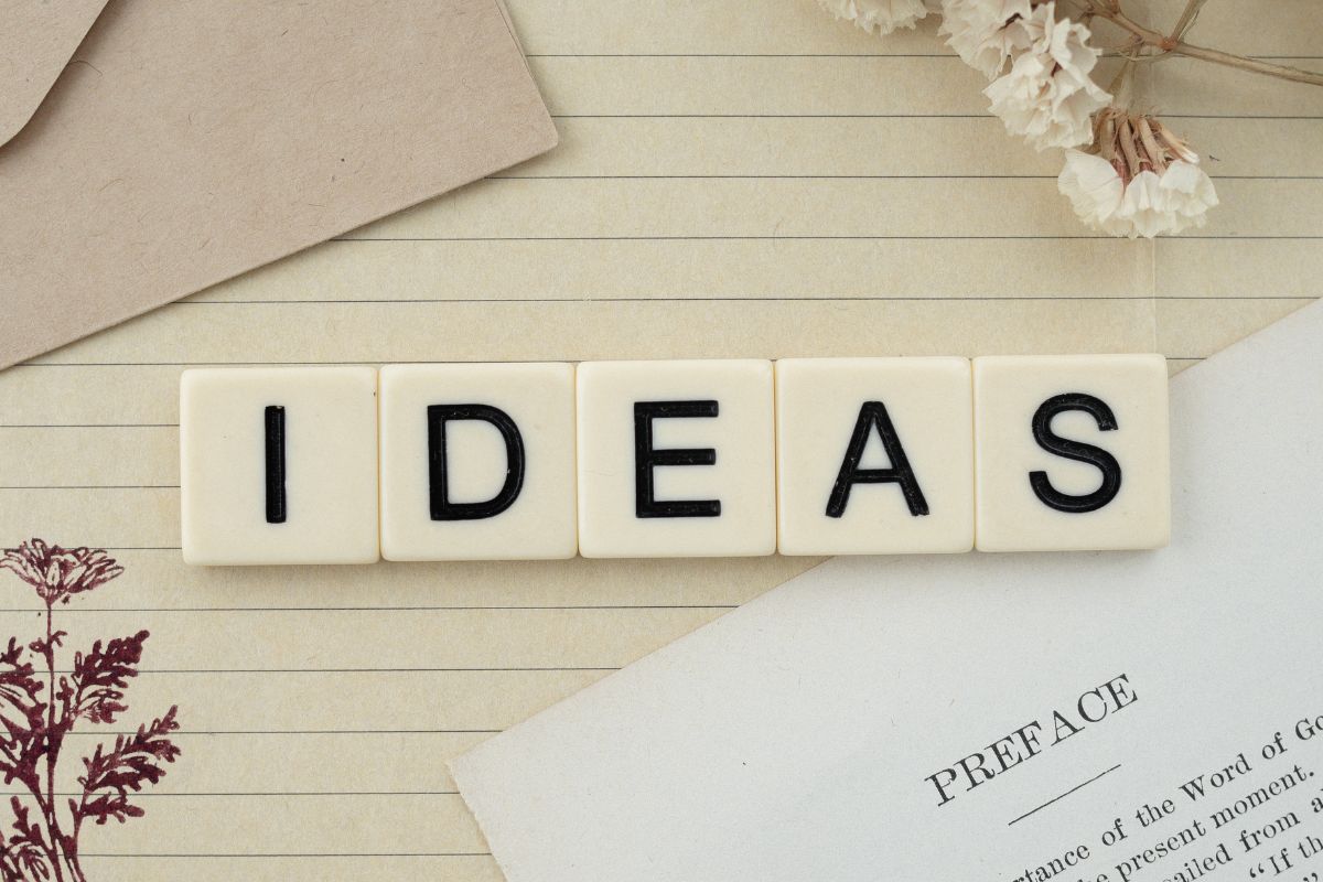 The image tells about an envelope, a flower, a piece of paper with notes, and wooden cubes with letters referring to you can do one of the following ways for teachers to make extra money while keeping things flexible.