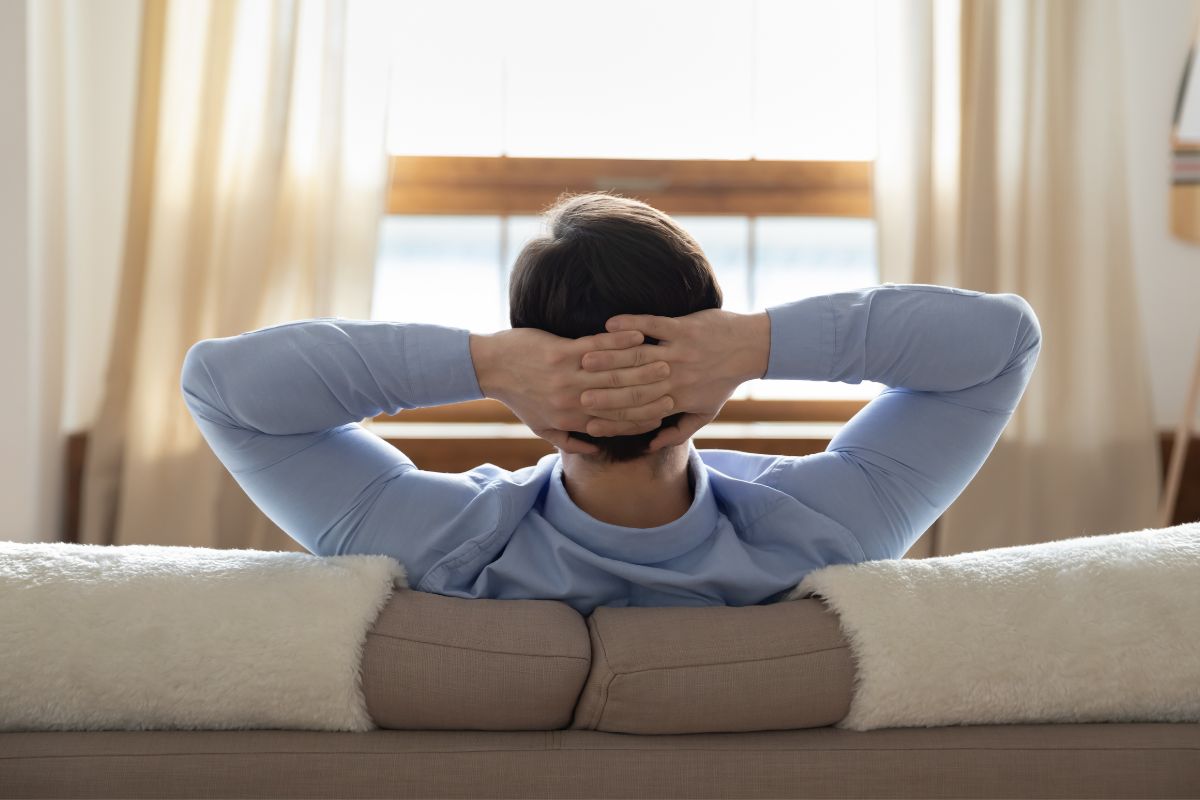 The photo shows a man housesitting.