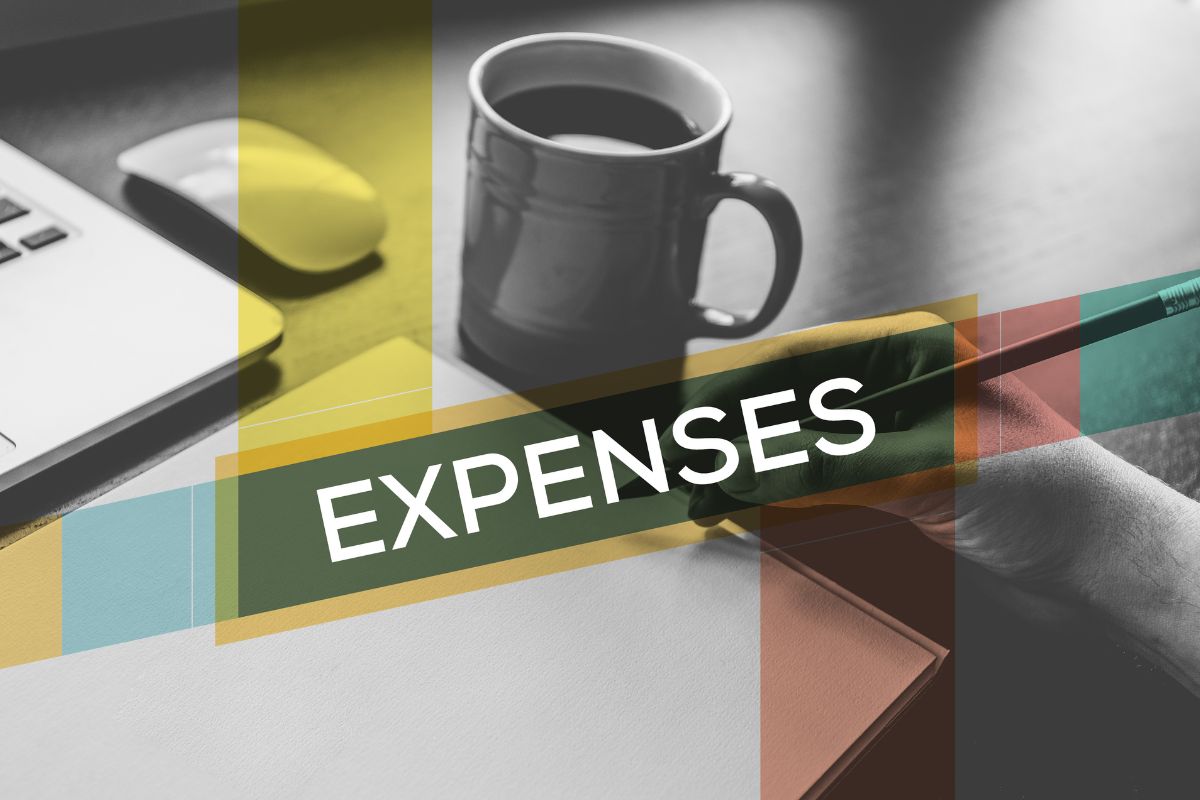 The photo shows a laptop and mouse, a coffee, a man's hand and writing on the paper, and a screen with a note display referring to some expenses you won't pay can help you plan better.