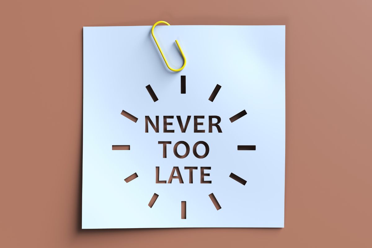 The image shows a paper with never too late wording.