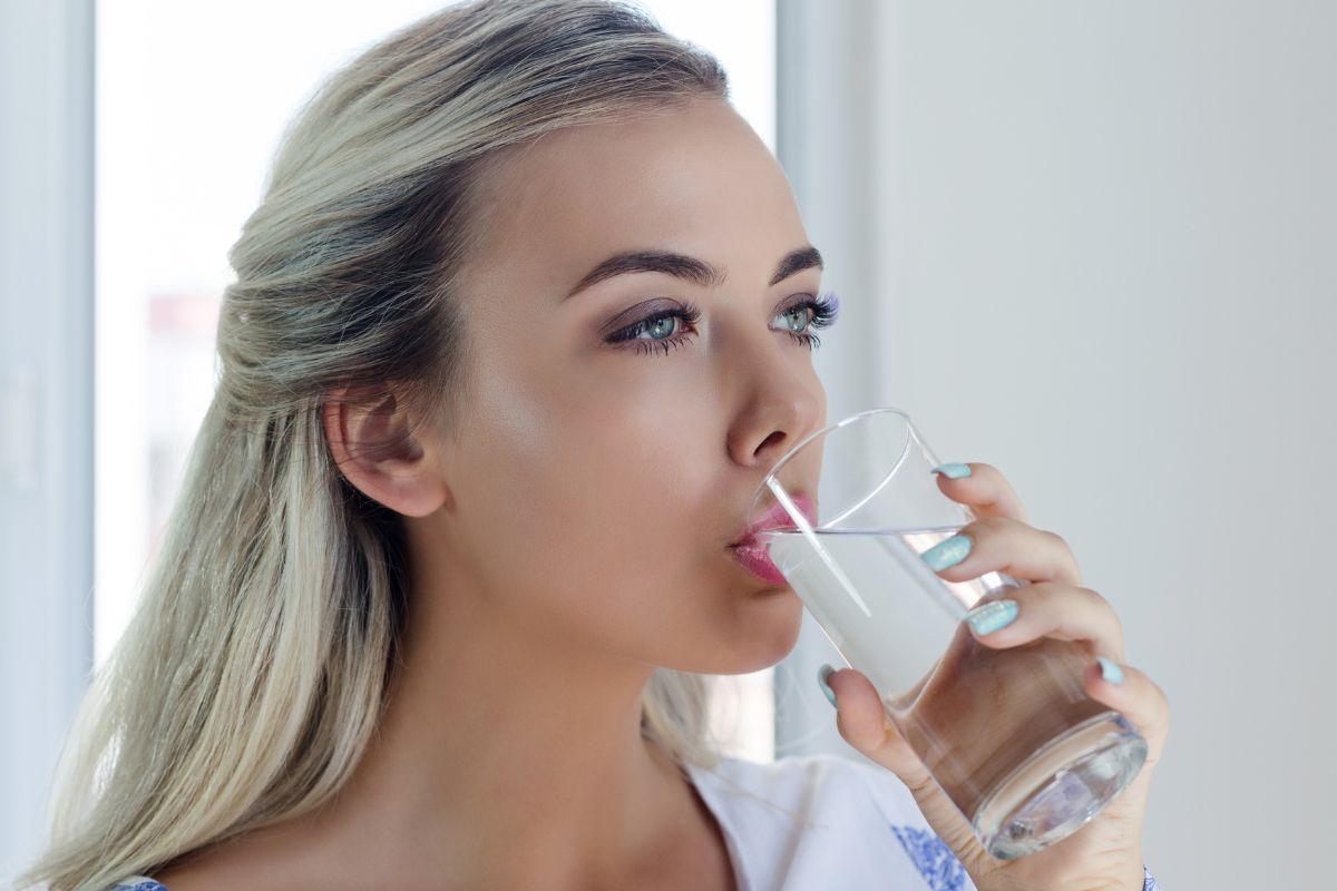 Picture of a girl drinking a glass of water.