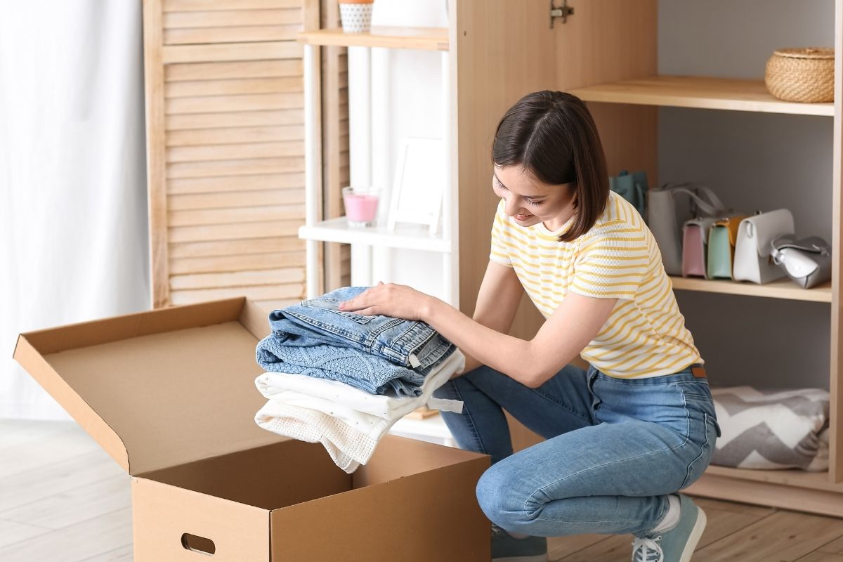 Photo of a woman decluttering.