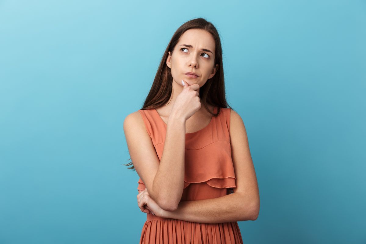 The photo shows a girl thinking deeply which means asking yourself if you are financially sound is the first step to getting rich.