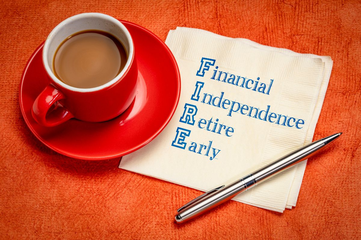 The photo tells about coffee, a pen, and tissues with notes indicating to uncover the FIRE movement if you want to be financially independent as fast as possible.