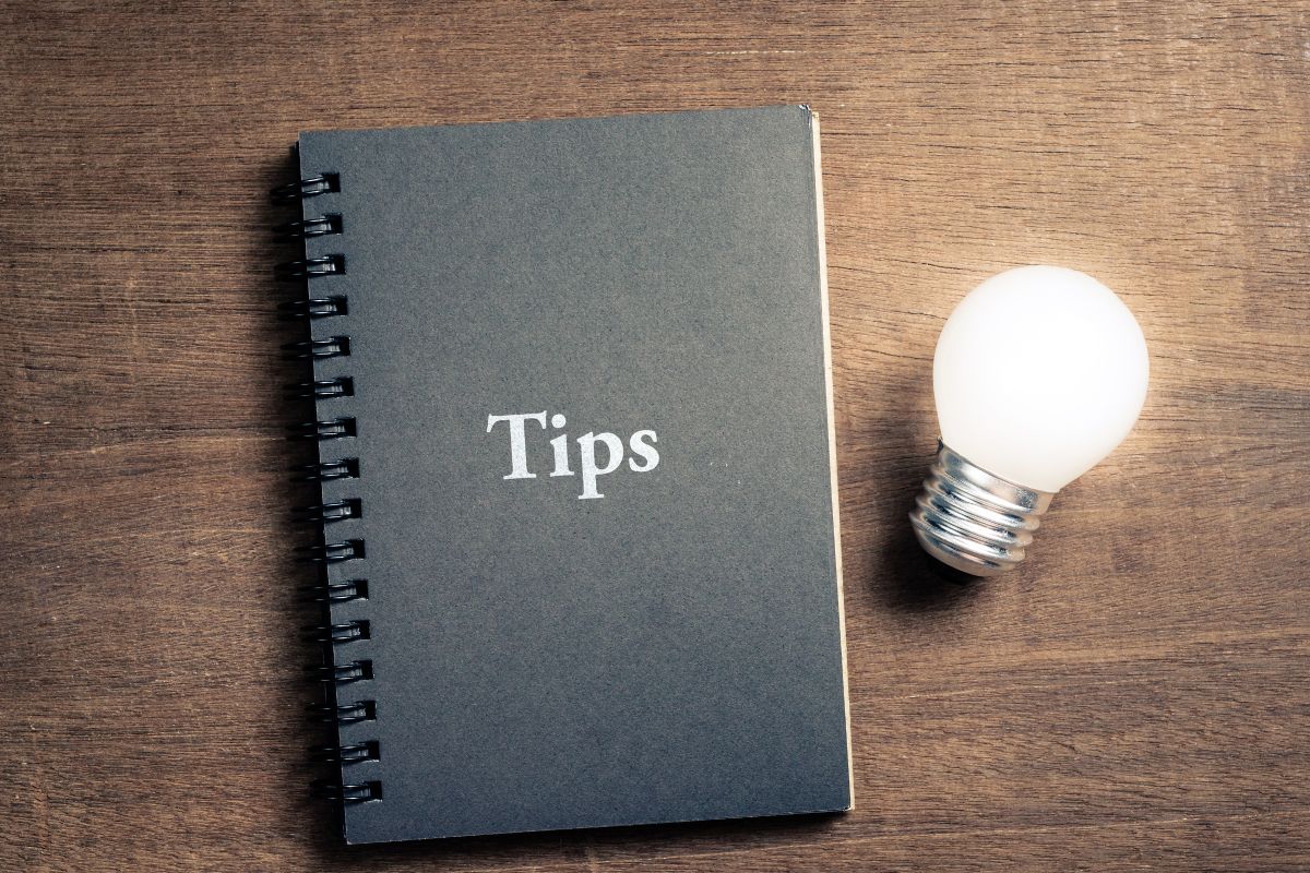 The picture is about a bulb and a notebook with tips text.