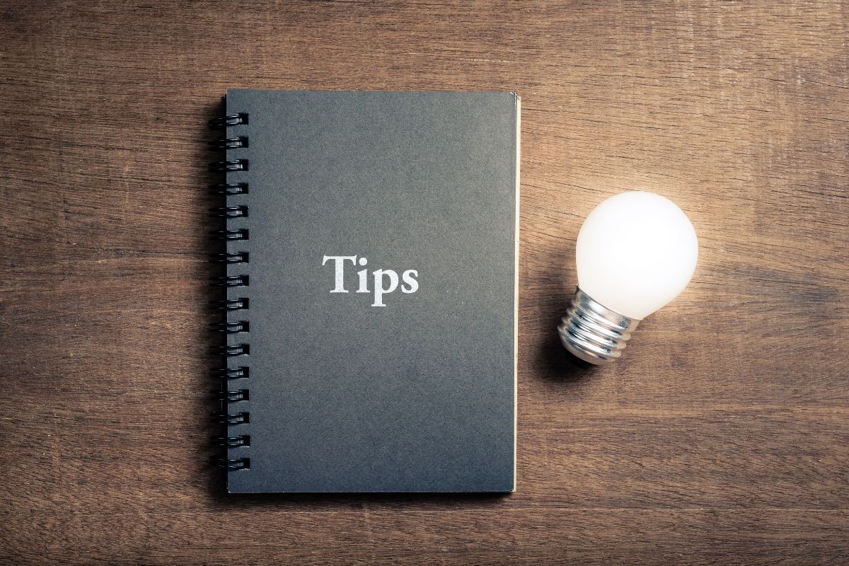 The picture tells about a bulb and a notebook with a note which refers to getting extreme is to reach FI faster can help you get there faster. 