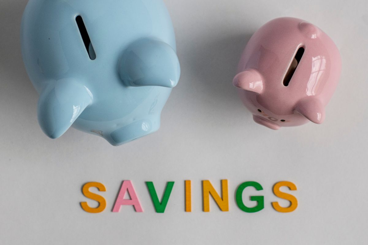 The picture tells about piggy banks and letters on the table indicating to start saving now to secure your future and for a better retirement.
