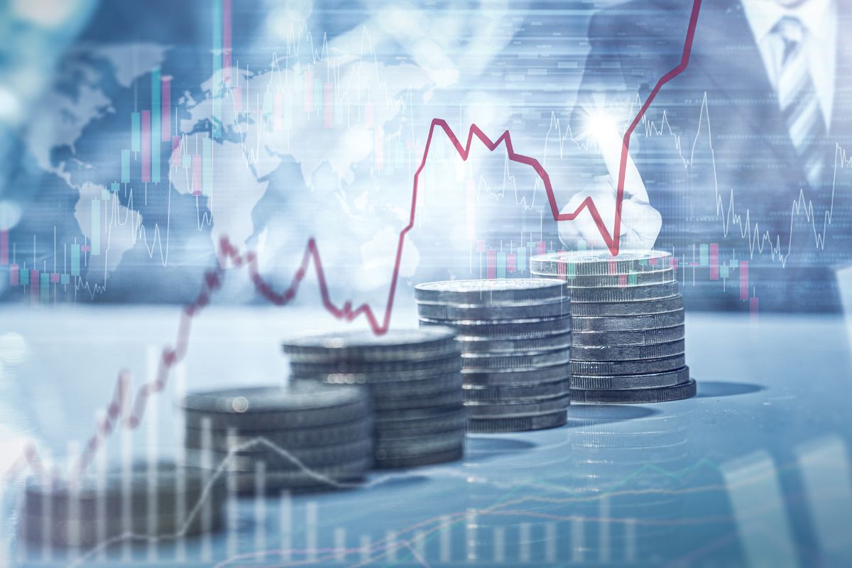 The photo tells about coin stocks and visual graphs which refer to diversified investments for growth help you build wealth and avoid big losses.