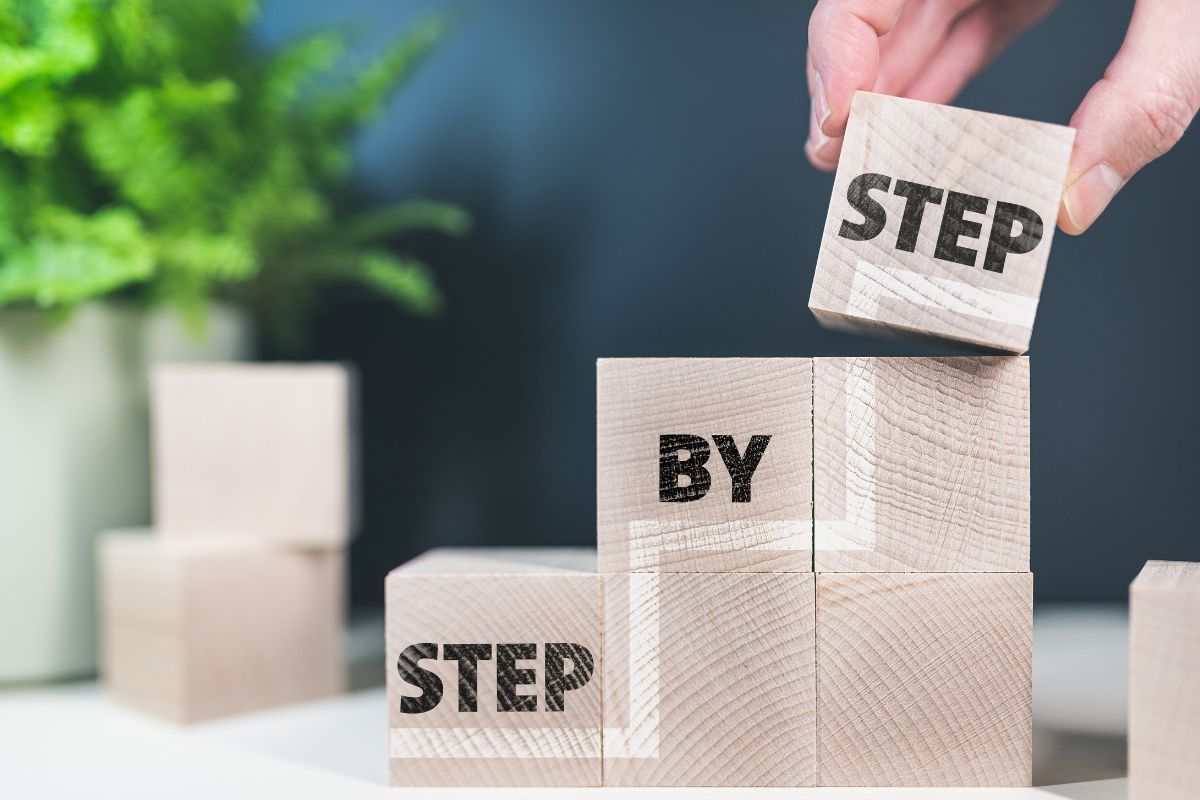 The photo shows a man's hand taking steps.