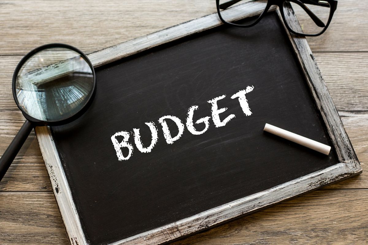 The picture shows a board with budget wording.