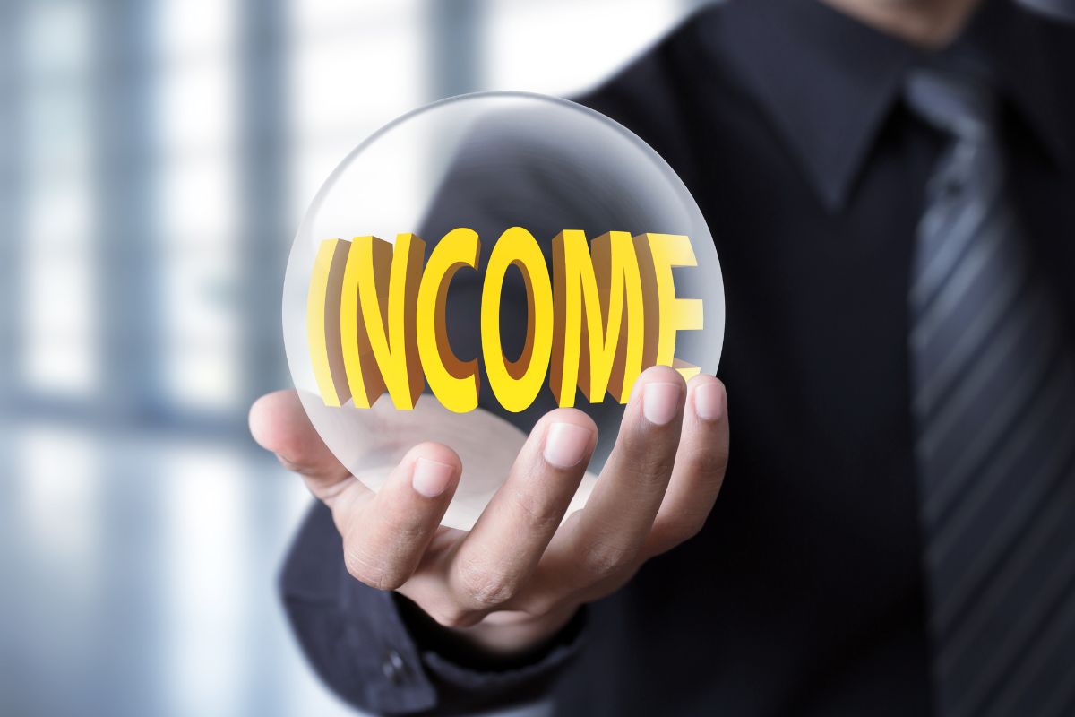 The image shows a man's hand holding a ball with a note referring to diversifying income streams as a smart wealth habit.