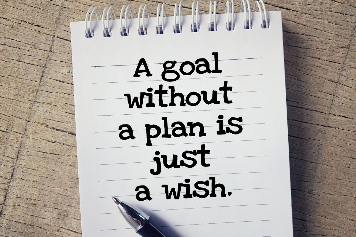 The picture shows a notebook with a quote.