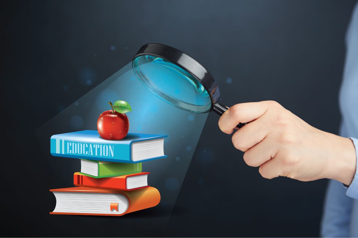 The image shows a man's hand with books.