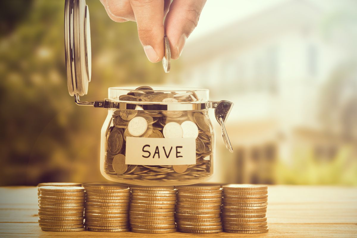 The photo shows a man's hand doing a money-saving challenge.