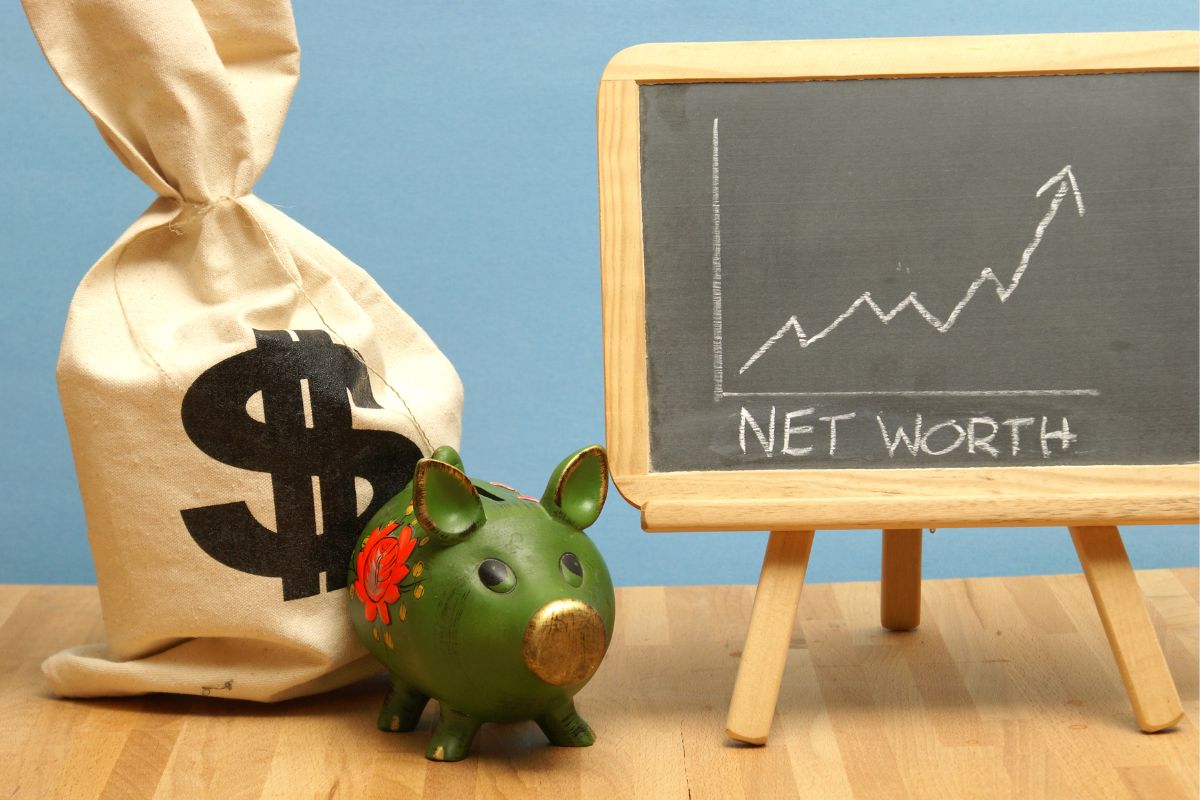 The picture shows a board with net worth wording.
