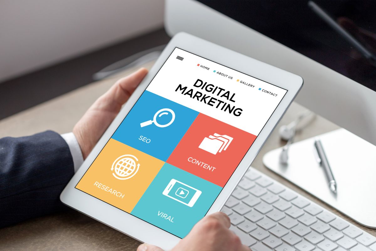 The image is about a man's hand working as a digital marketer.