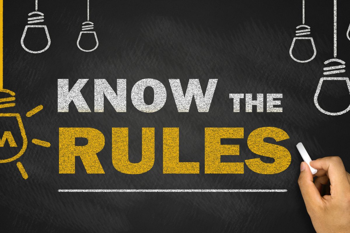 The image shows a board with the rules wording.