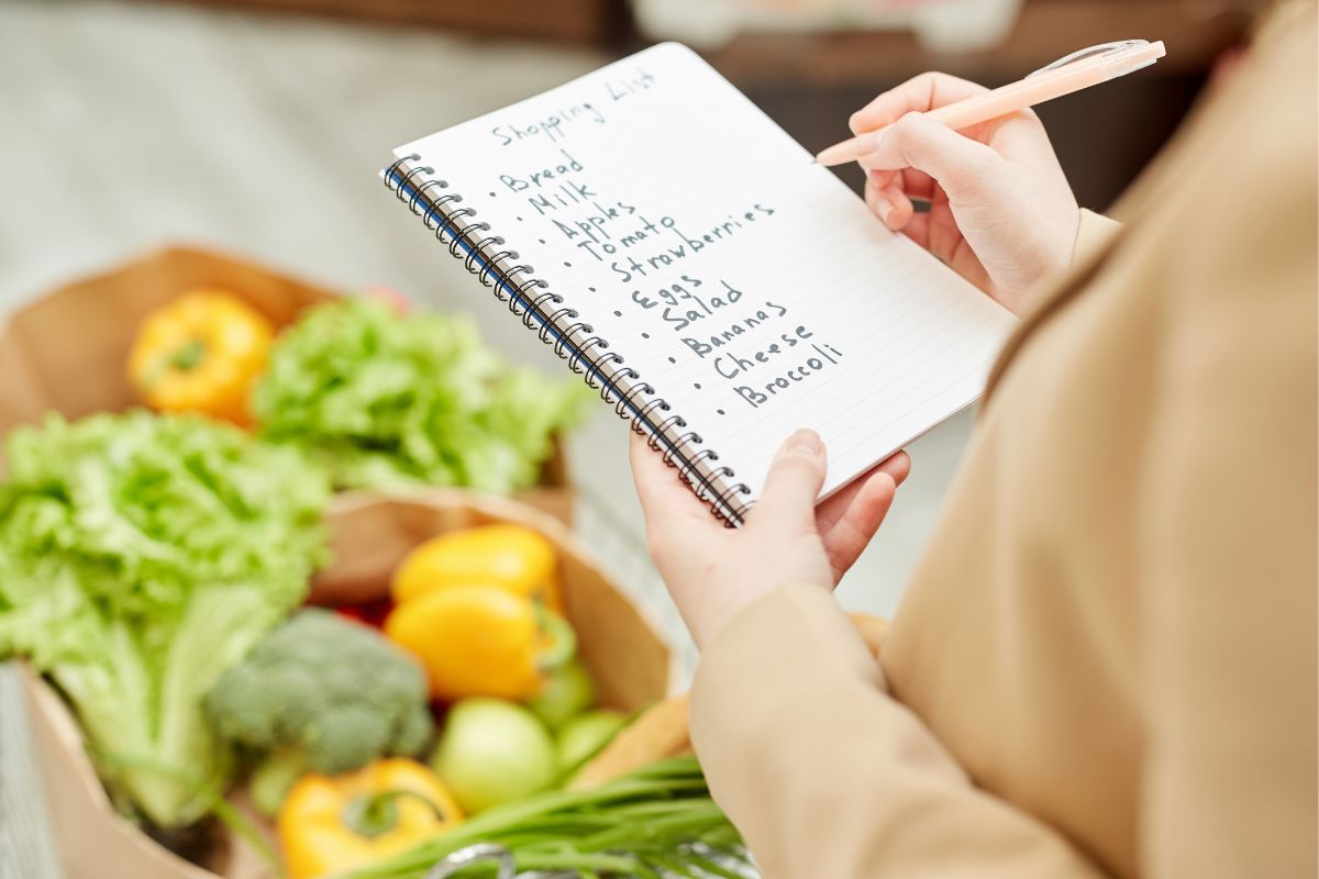 The photo is about a lady with a shopping lists.