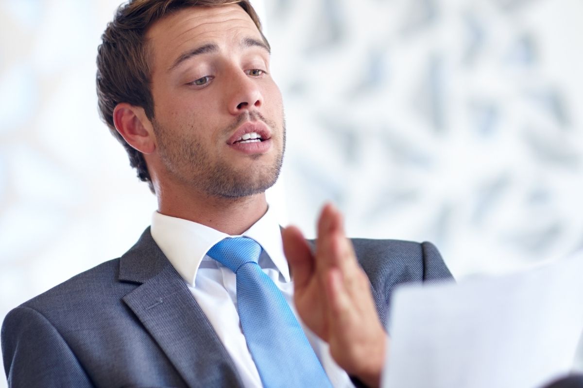 The image shows a man practicing his pitch.