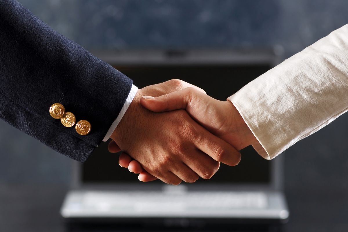 The photo is about shaking hands.