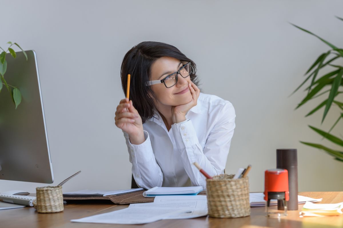 The image shows a woman thinking.