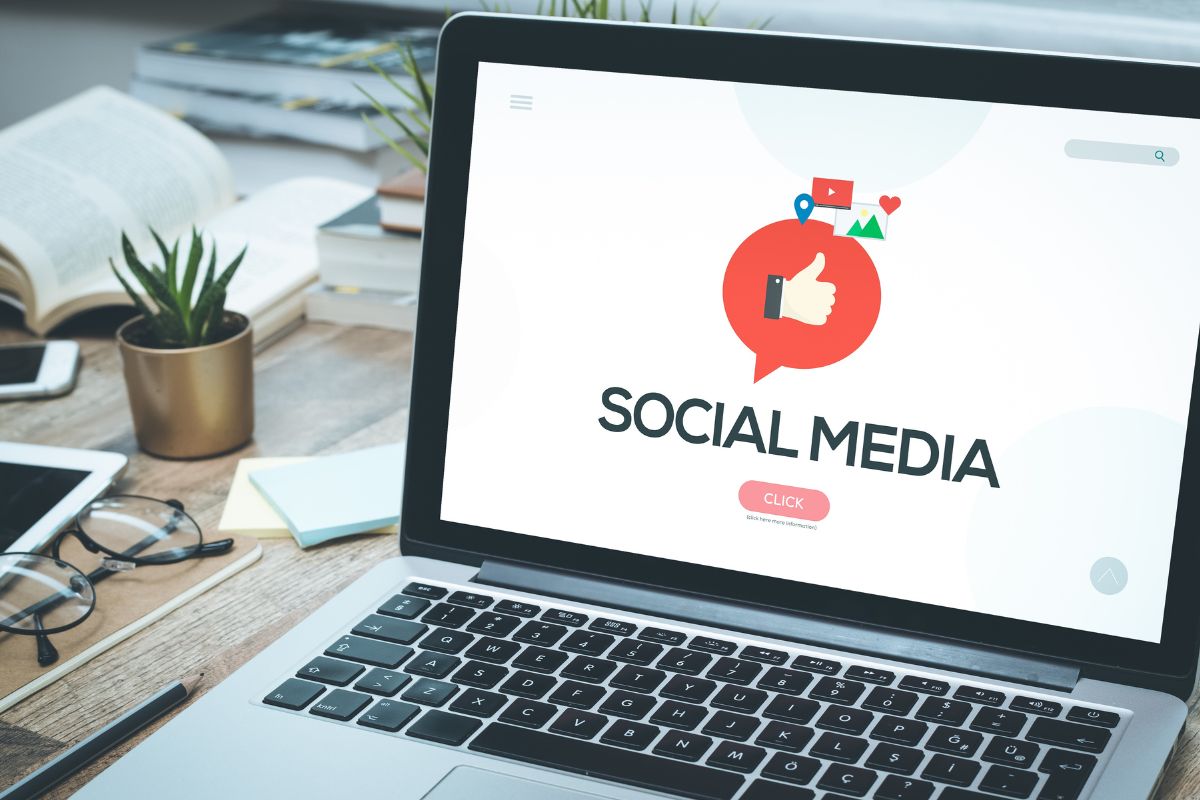 The picture shows a laptop with social media wording.