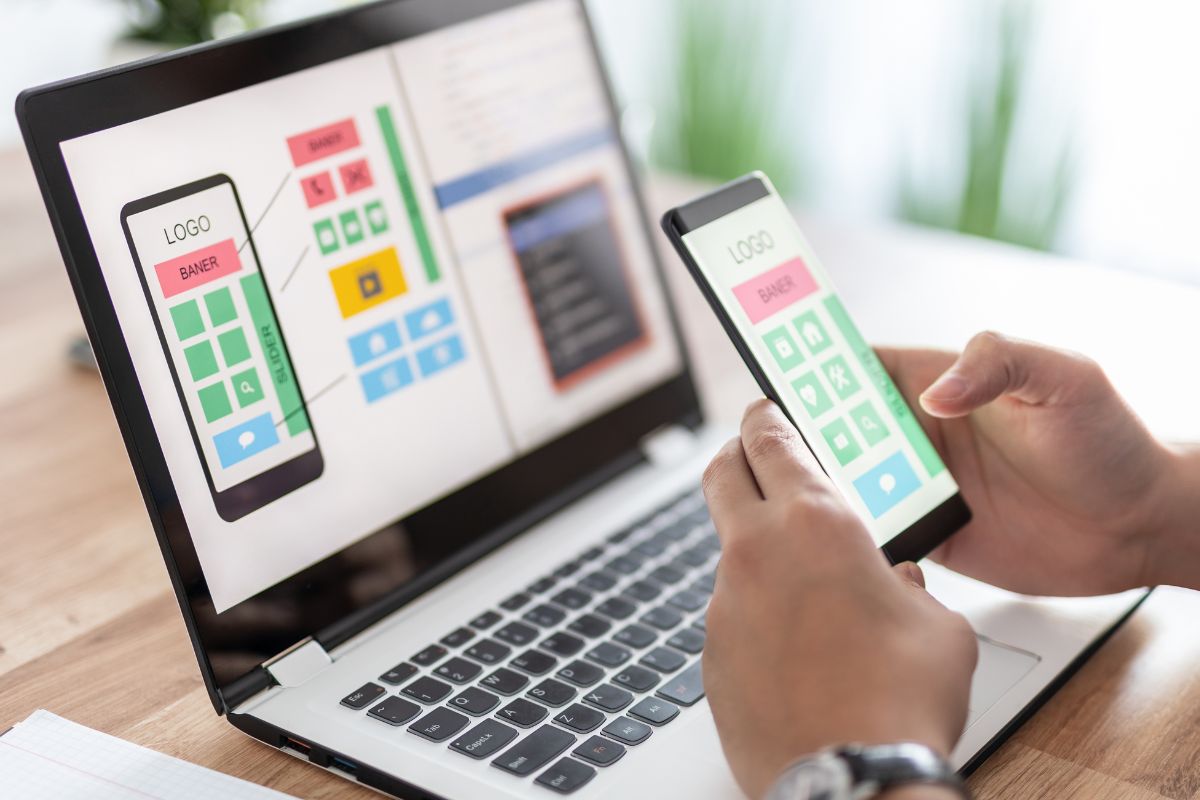 The photo shows a man's hand working as an App developer.