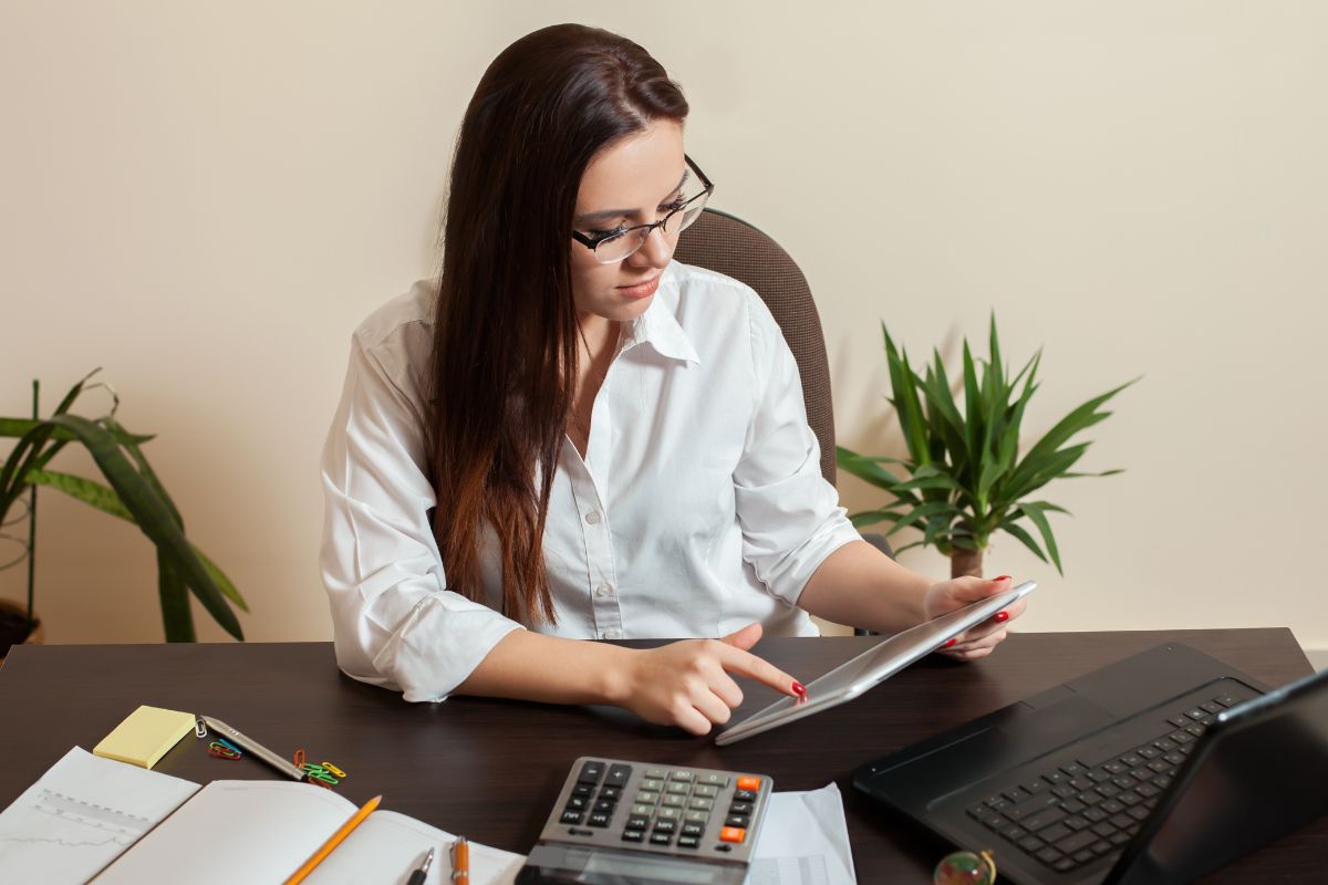 The picture shows a woman working as a bookkeeper.