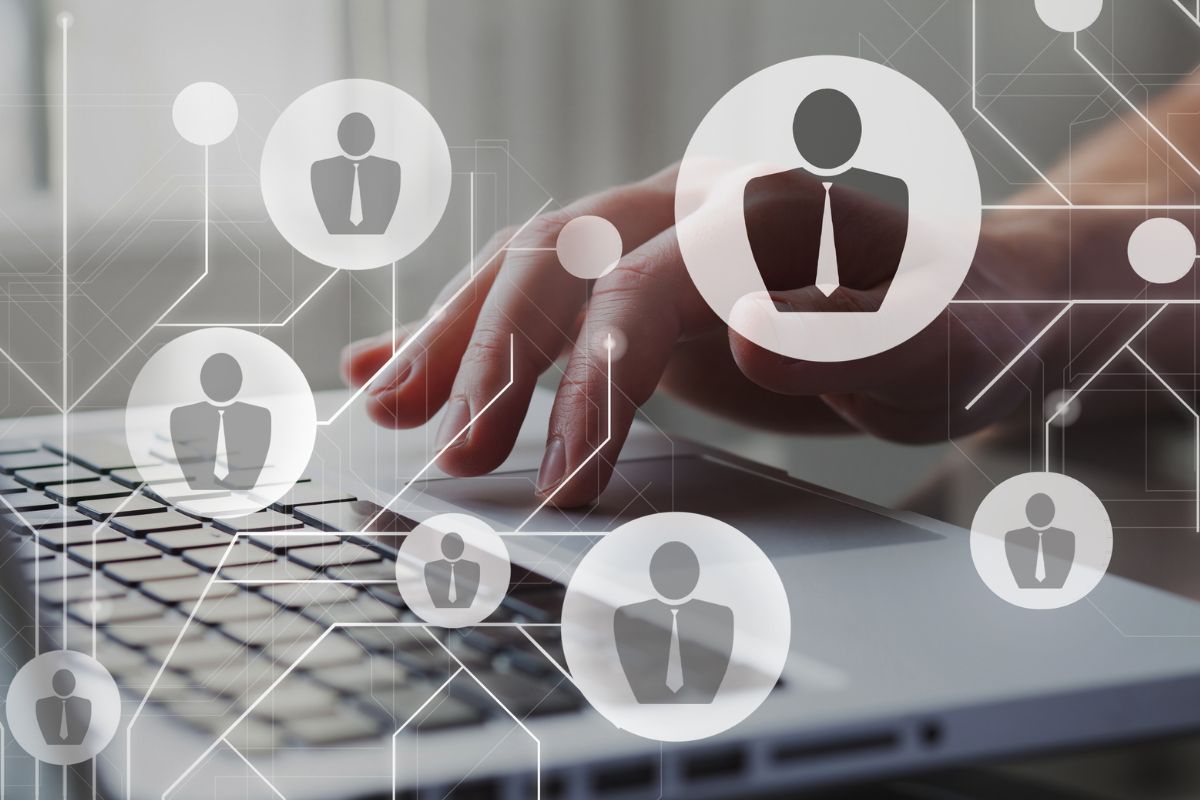 The image is about a lady's hand working as a recruiter.