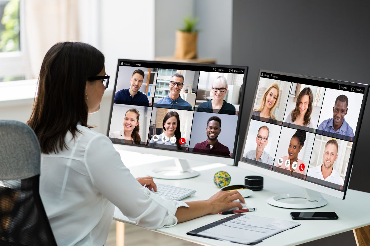 The photo shows a woman working as an online community manager.