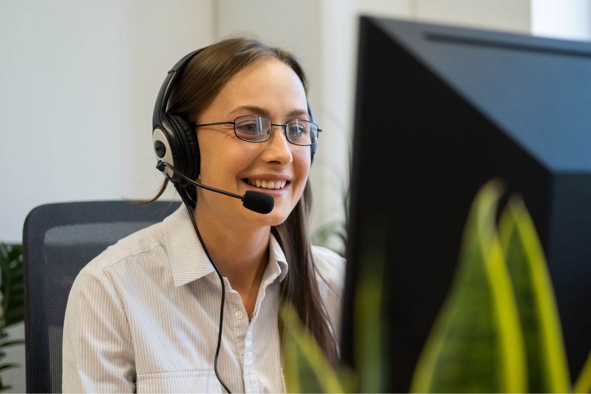 The phot is about a girl working as a customer service.