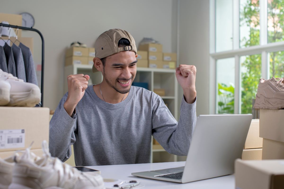 The photo shows a man with an e-commerce business.