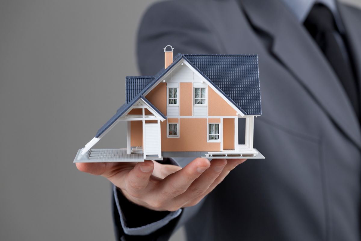 The image shows a man with real estate knowledge.