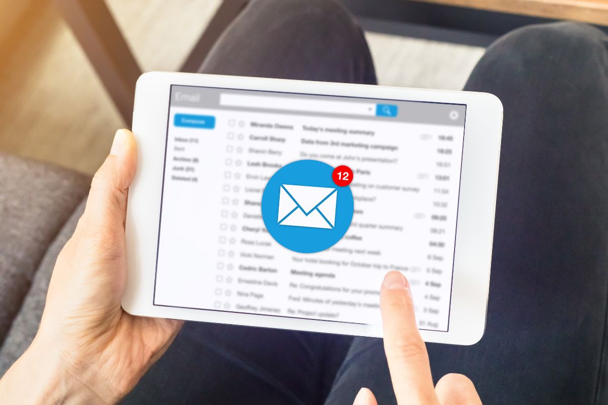 The picture shows a woman's hand unsubscribing from emails.