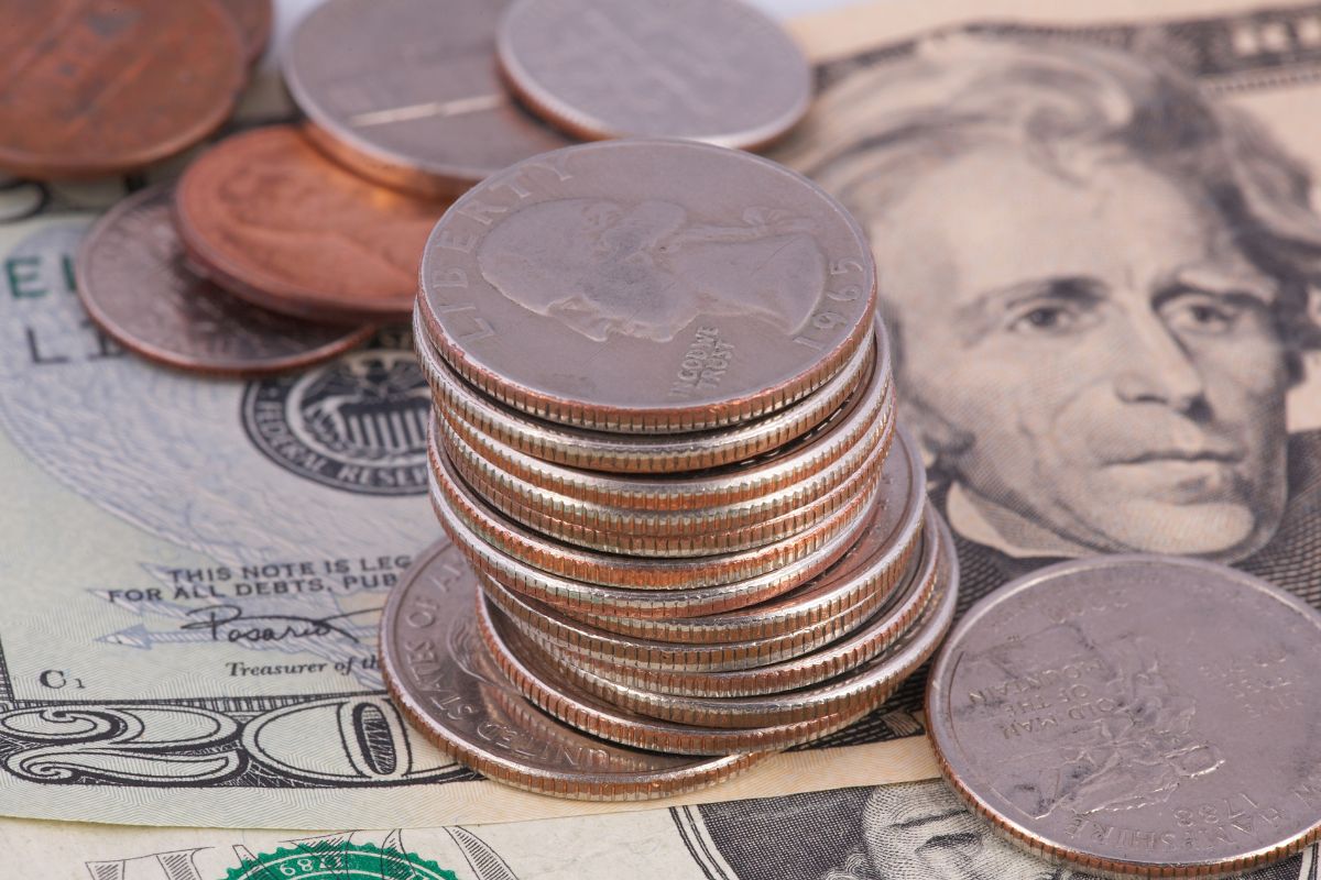 The photo shows coins to round up purchases into savings.