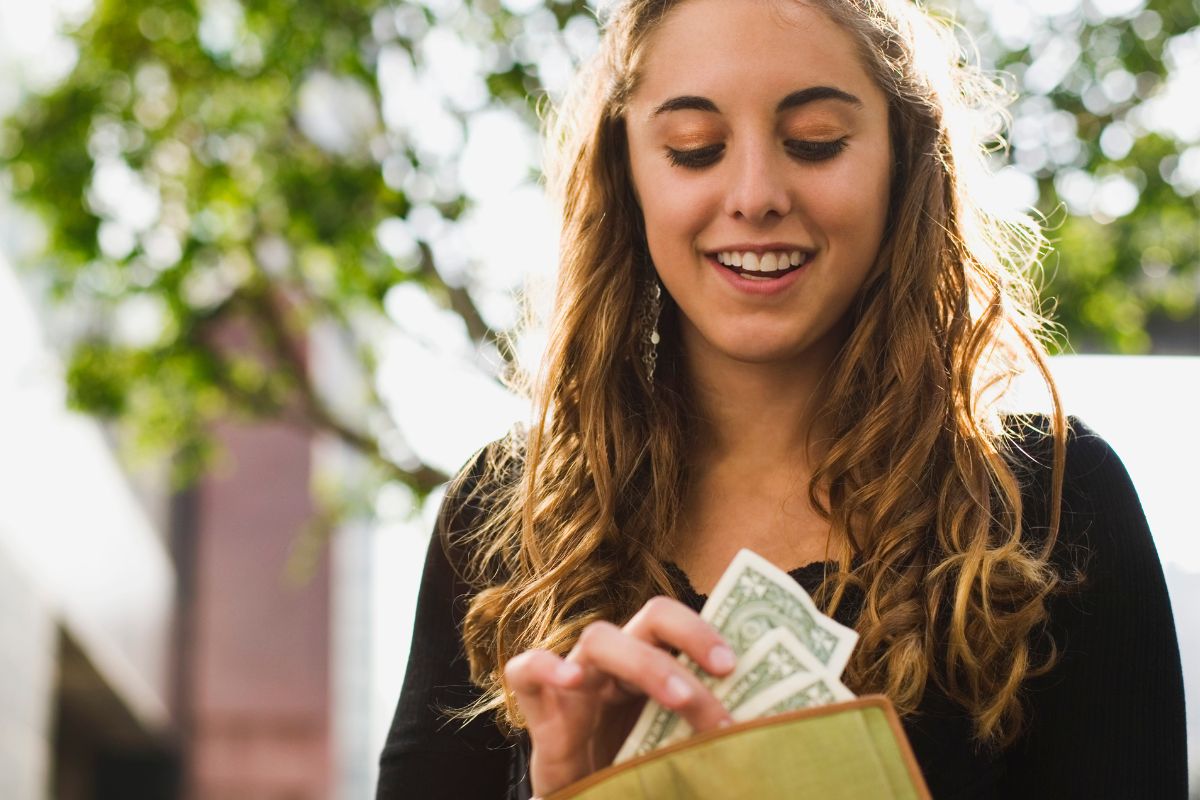 The photo shows a young lady setting a spending challenge.