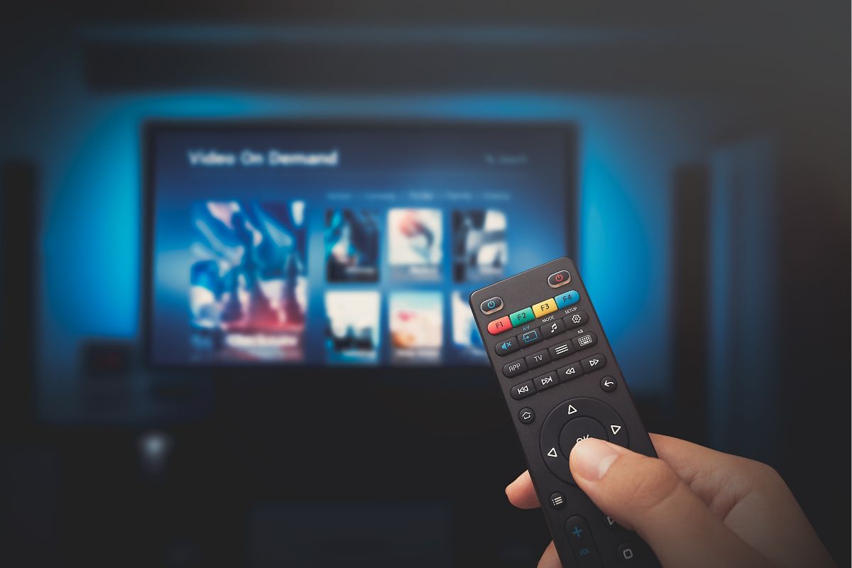 The photo shows a lady's hand sharing streaming services with family.