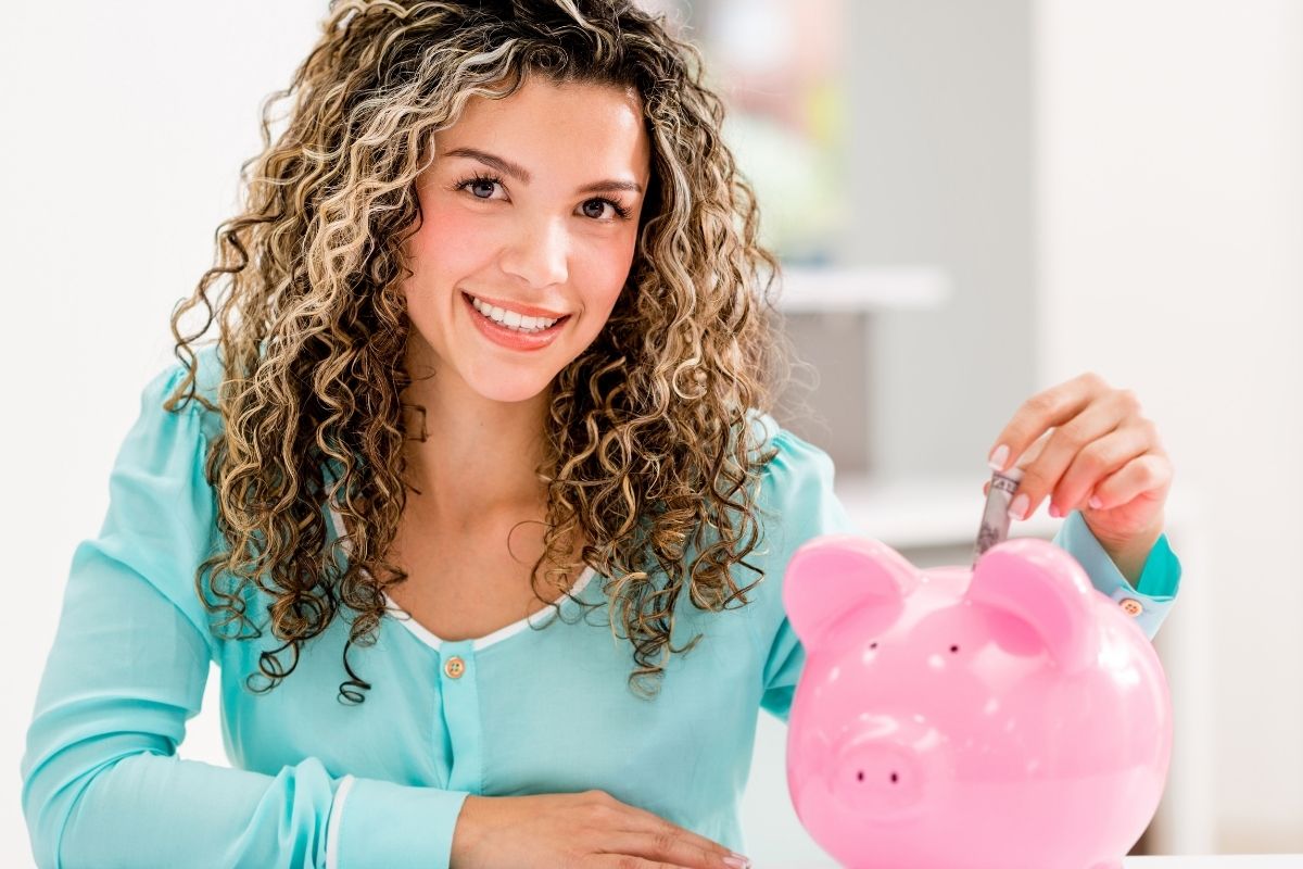 The photo shows a woman doing a 52-week savings challenge.
