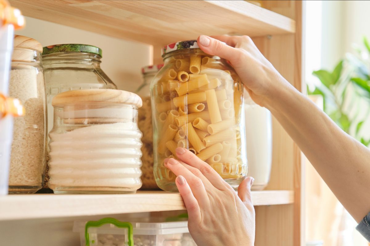The picture shows a lady's hand doing a pantry challenge.