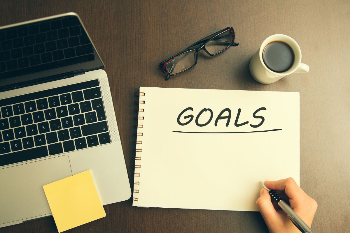 The image shows a lady's hand making goals.